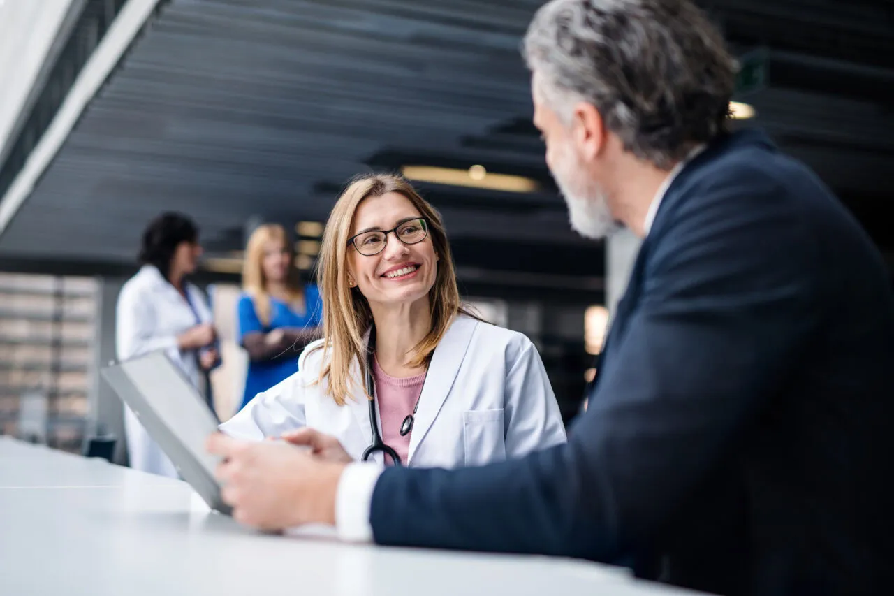 Doctor talking to a pharmaceutical sales representative.